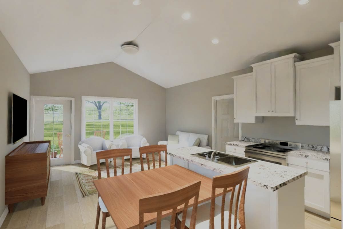 Open-concept living area with vaulted ceiling, showing kitchen island with sink, dining area, and seating.