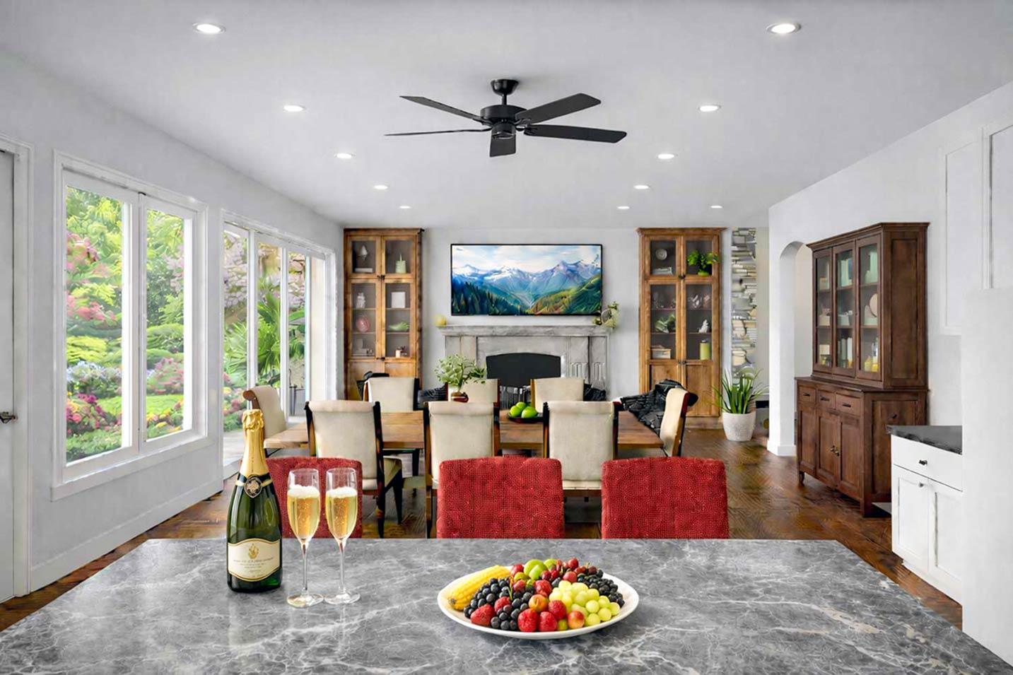 Open concept living and dining area with fireplace, large windows, and built-in cabinetry.