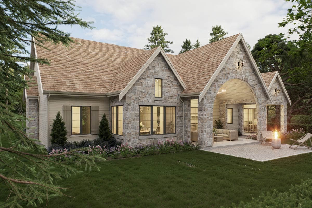 House plan exterior with stone facade, arched covered patio, and gable rooflines.