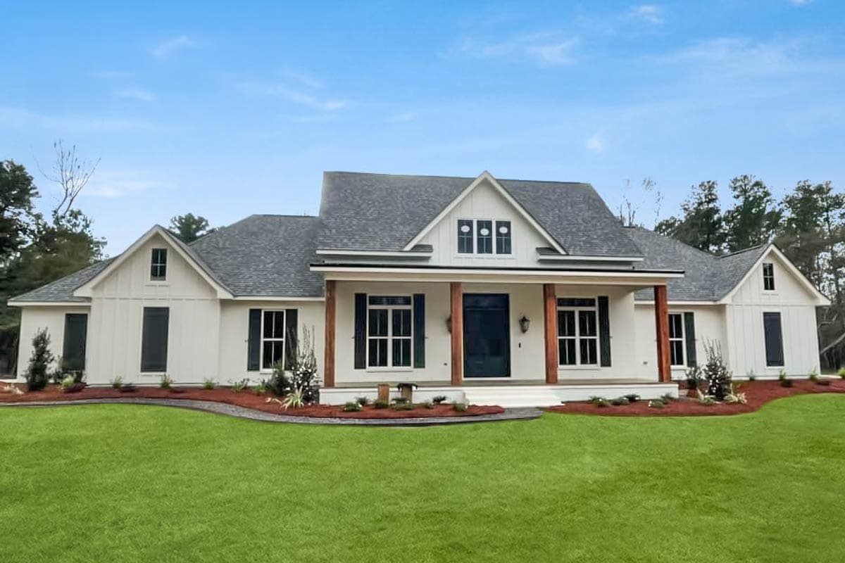 Modern Farmhouse house plan exterior with gabled dormers, board-and-batten siding, and a covered front porch supported by wood columns.
