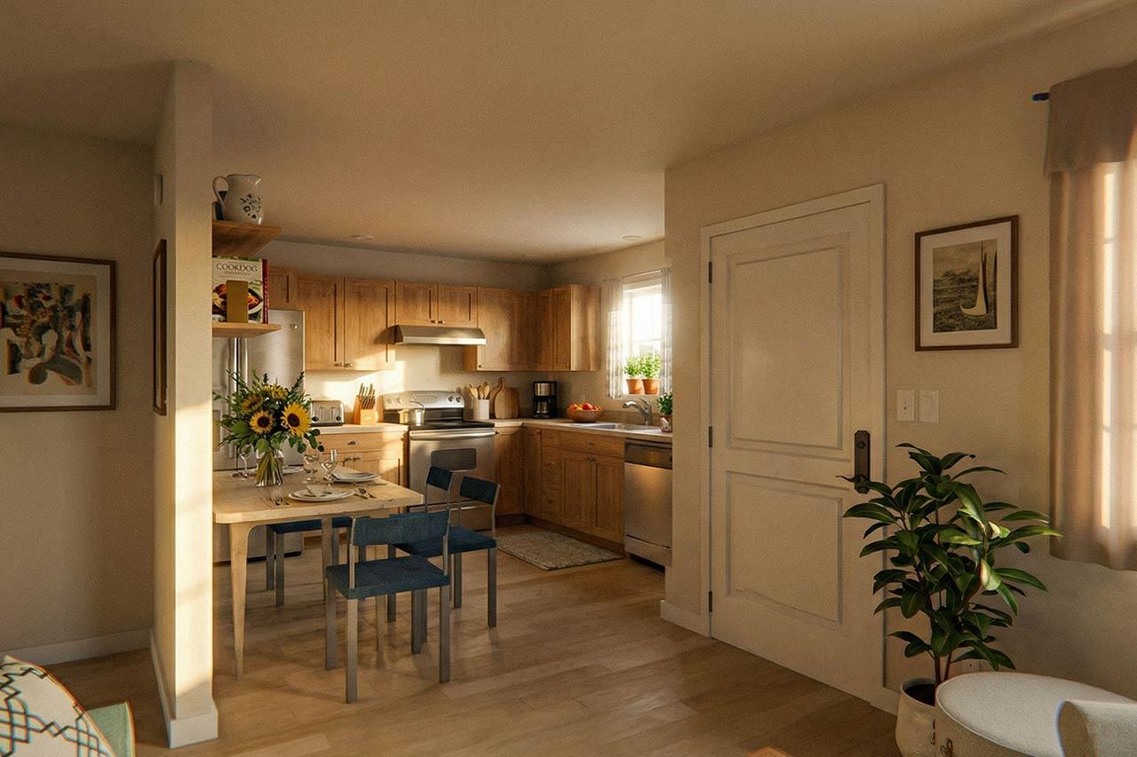 Interior view of a kitchen with wood cabinets, stainless steel appliances, a dining table, and a doorway.