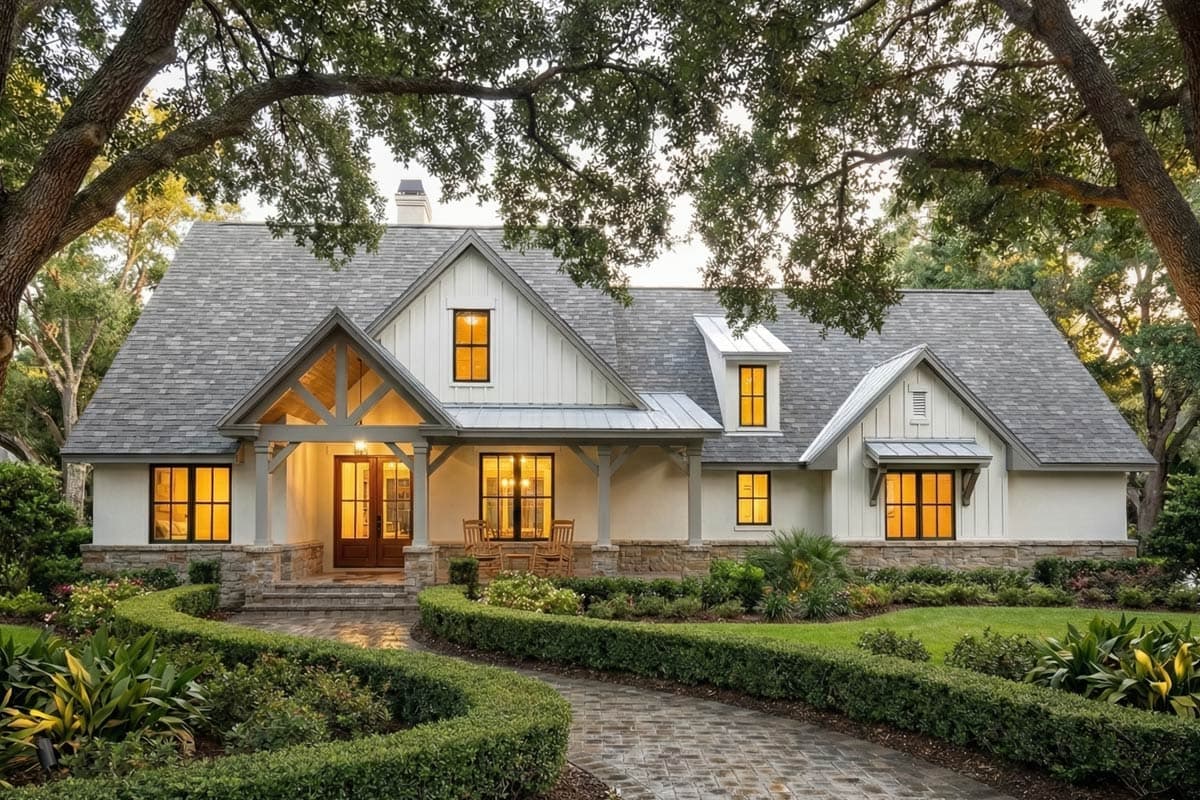 Modern Farmhouse house plan exterior with prominent gables, dormers, stone accents, and a covered entry with timber framing.