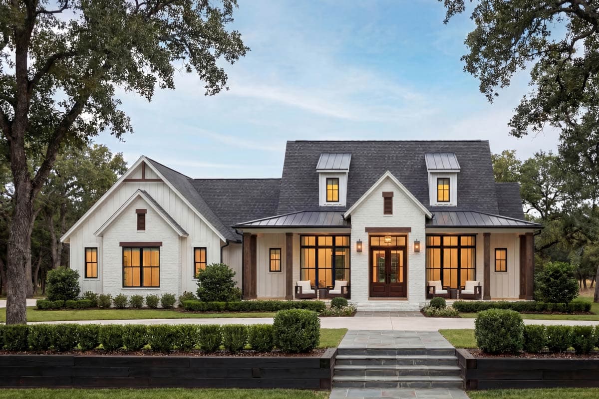 Modern Farmhouse house plan exterior with gabled dormers, covered porch with wood columns, and white brick and board-and-batten siding.