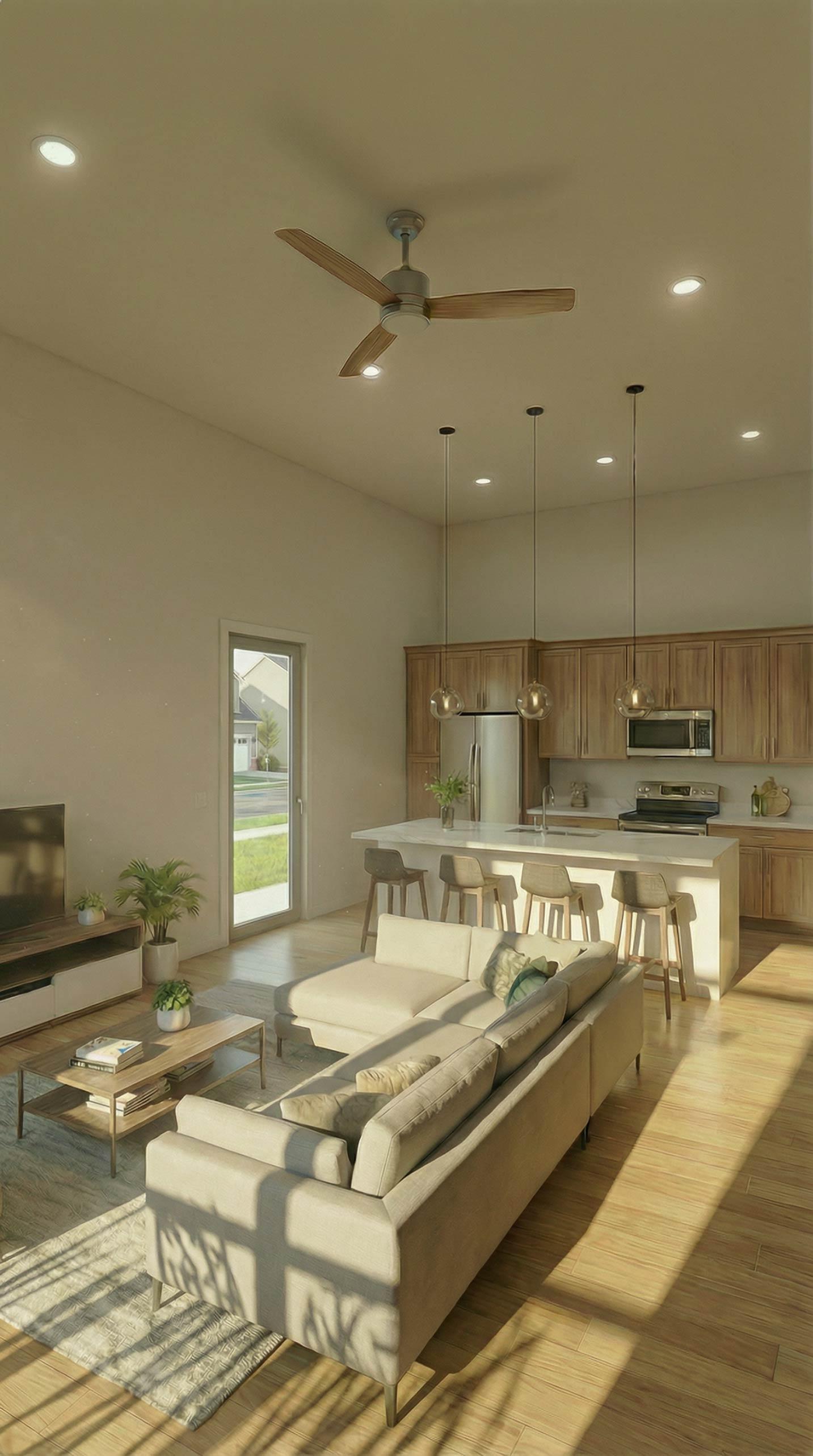 Interior rendering of a living area with kitchen, island, sectional sofa, and television.