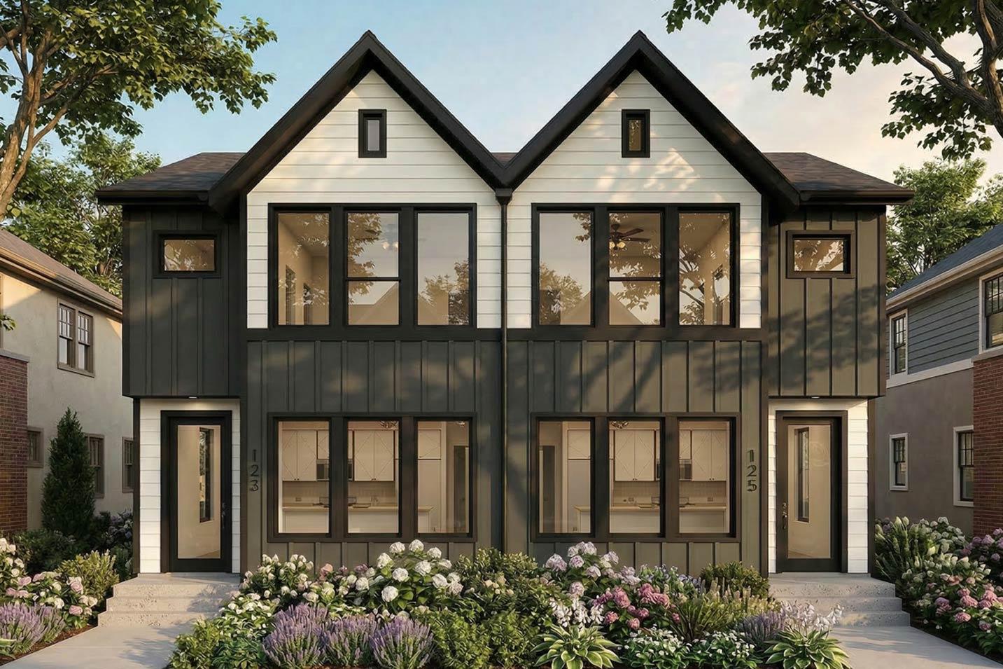 Modern farmhouse exterior: two stories, dark vertical siding, white gables with dormer windows, and large black-framed windows.