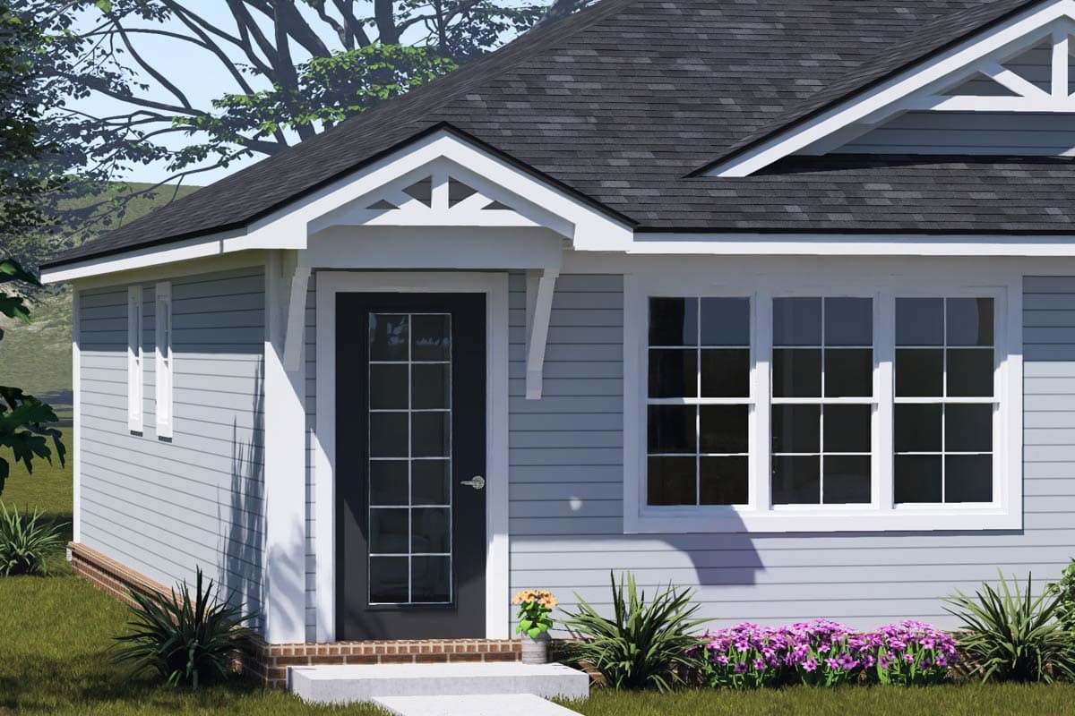House plan exterior: Single-story home with a covered entryway, gable trim detail, and multi-pane windows.
