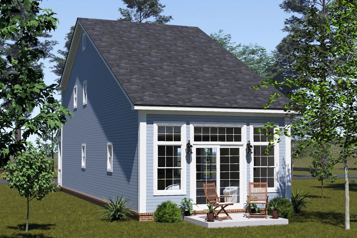 House plan exterior: Two-story home with blue siding, gables, dormers, and a sunroom with large grid windows and French doors.