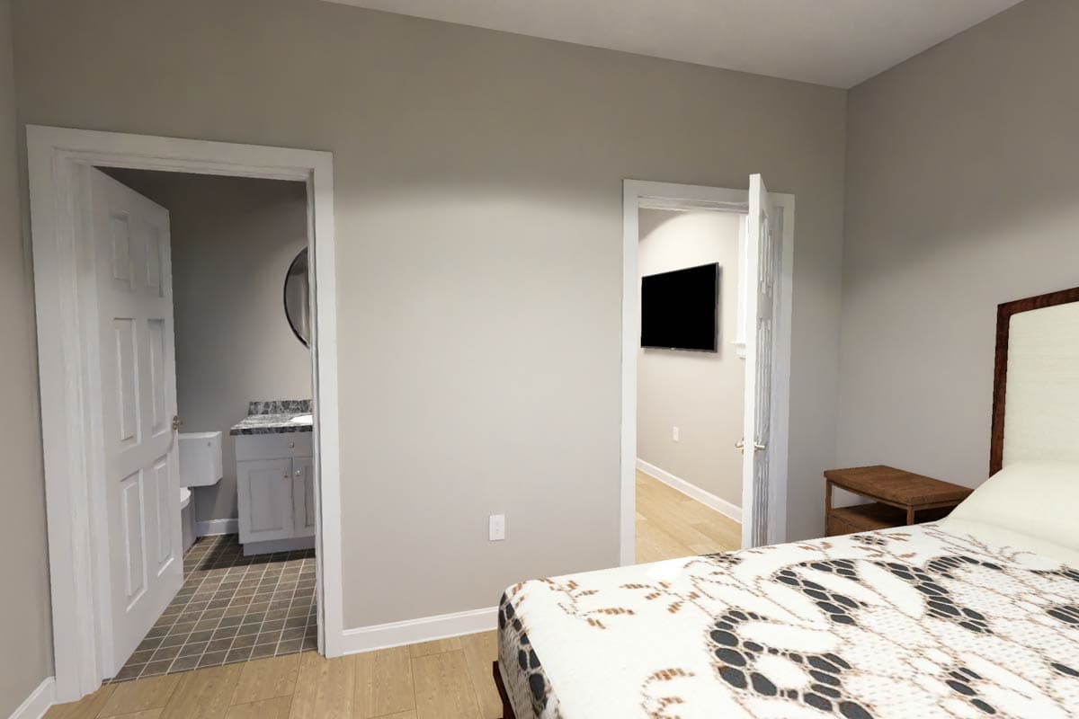 Bedroom interior with doors opening to a bathroom and a hallway with a wall-mounted TV.