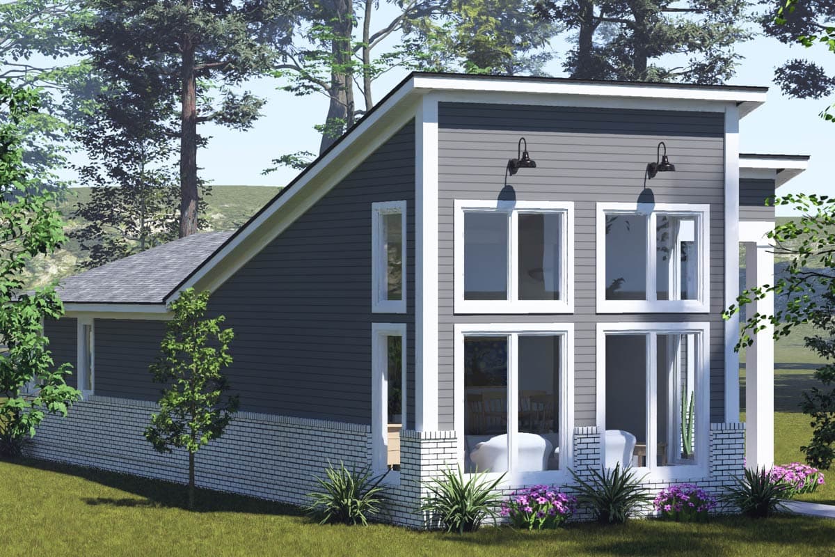 Modern house plan exterior with a steeply pitched gable roof, vinyl siding, brick base, and multiple large windows.