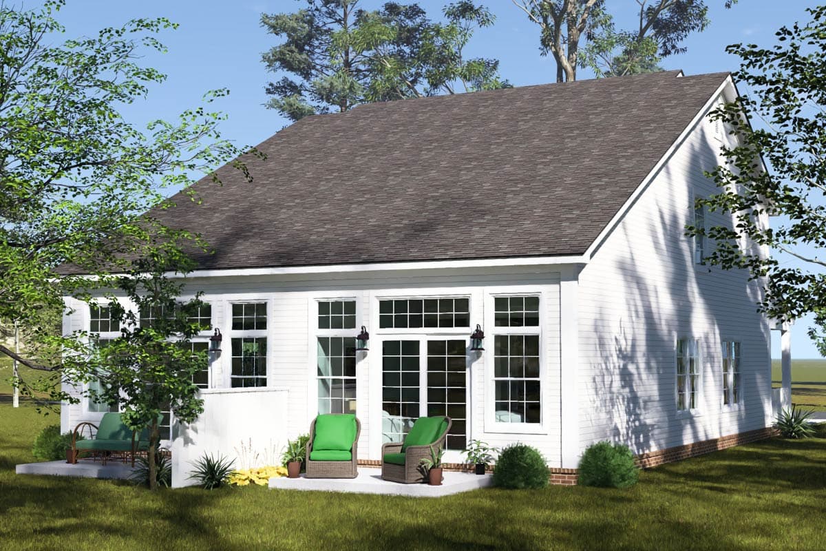 House plan exterior, two stories, white siding, large windows, gabled roof, and patio area with furniture.