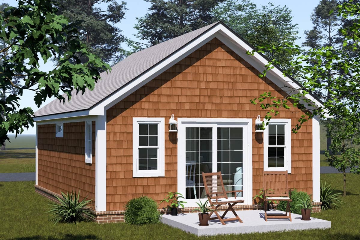 House plan exterior: one-story cottage style with cedar shingles, white trim, dual-pane windows, and sliding glass doors.