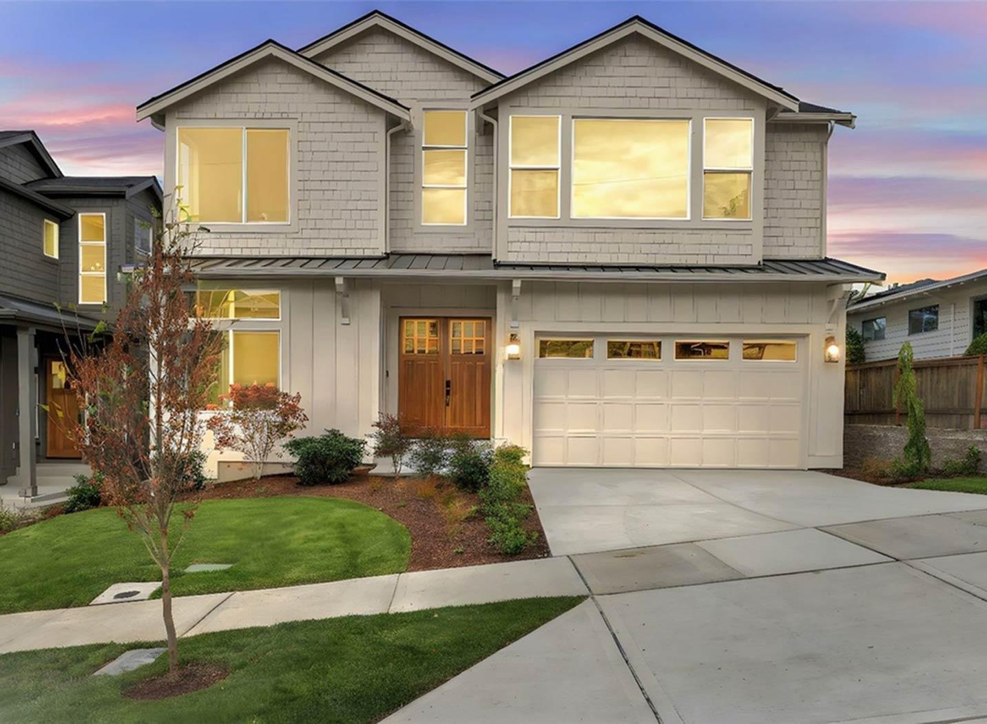 House plan exterior: Two-story home with gabled rooflines, prominent dormers, wood double front doors, and an attached two-car garage.