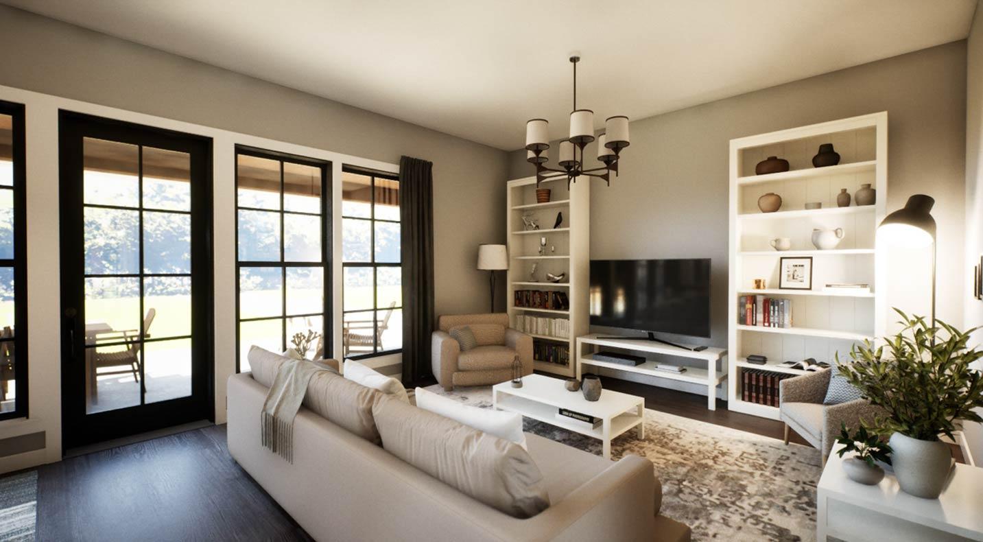 Living room interior with large windows, sofa, armchair, coffee table, two bookshelves, and television.