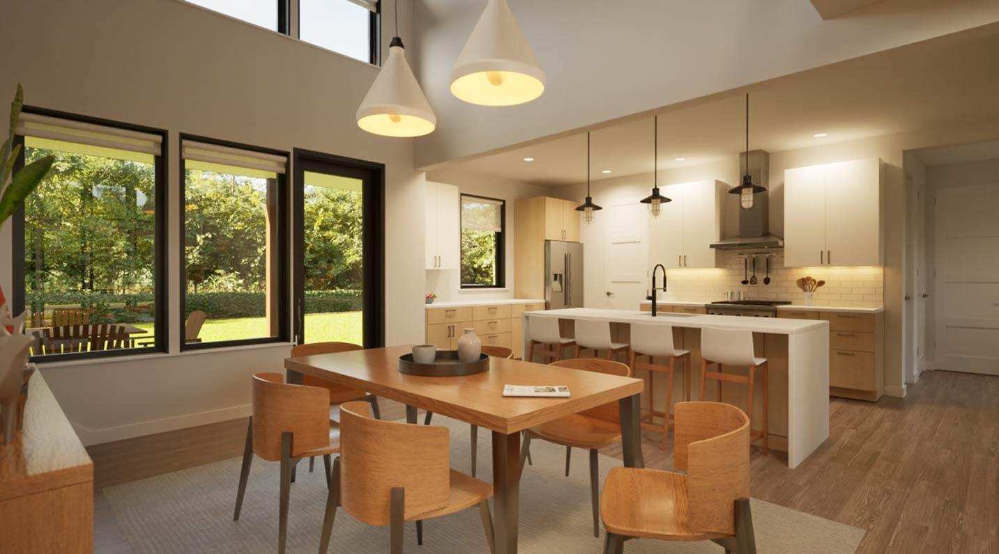 Dining area and kitchen with island, pendant lights, large windows, and vaulted ceiling.