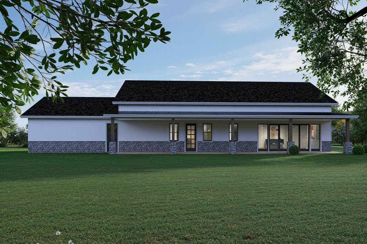 Modern Farmhouse house plan exterior with a wide covered porch, stone wainscoting, and large glass doors.