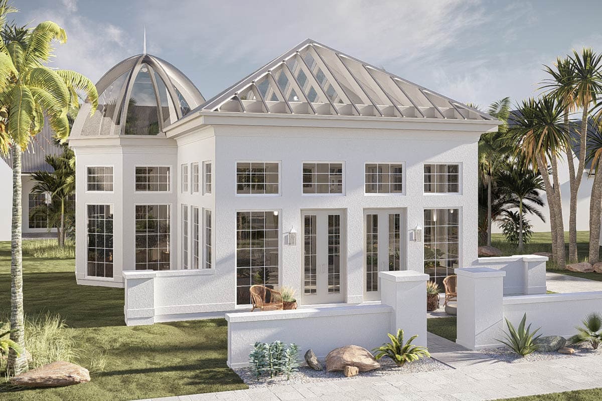 House plan exterior with glass-domed conservatory and gabled skylight roof. White stucco walls, numerous windows, and double doors.