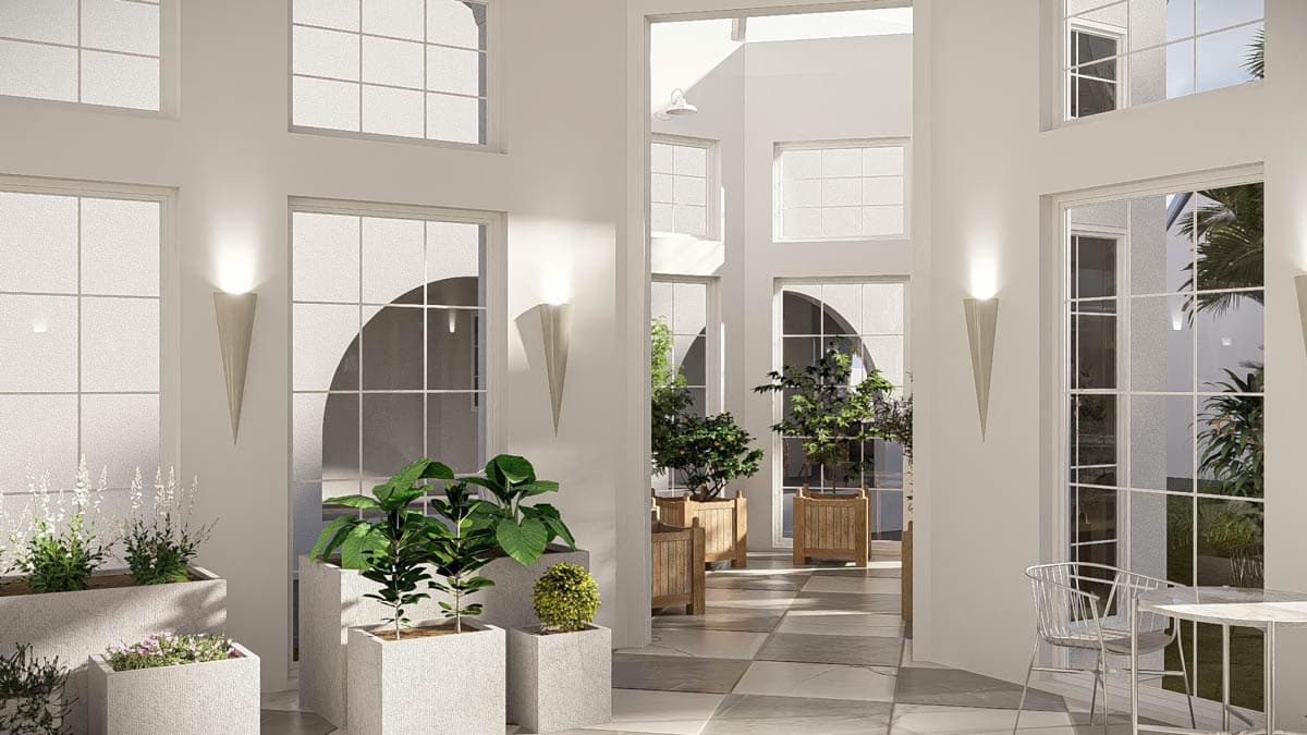 Interior rendering of a sunlit atrium with large windows, planters, and sconce lighting.