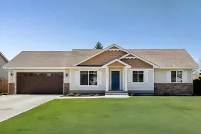 Cozy Ranch House Plan with Vaulted Living and 2-Car Garage