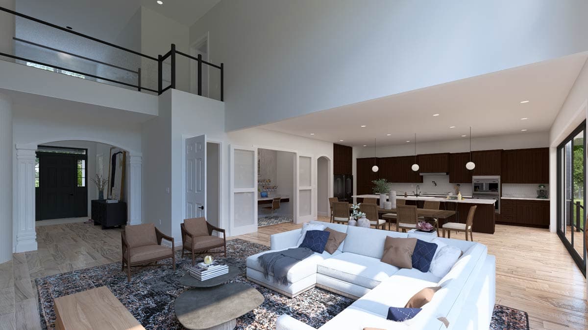 Open-concept living space with vaulted ceilings, a modern kitchen with island, and a loft overlooking the great room.