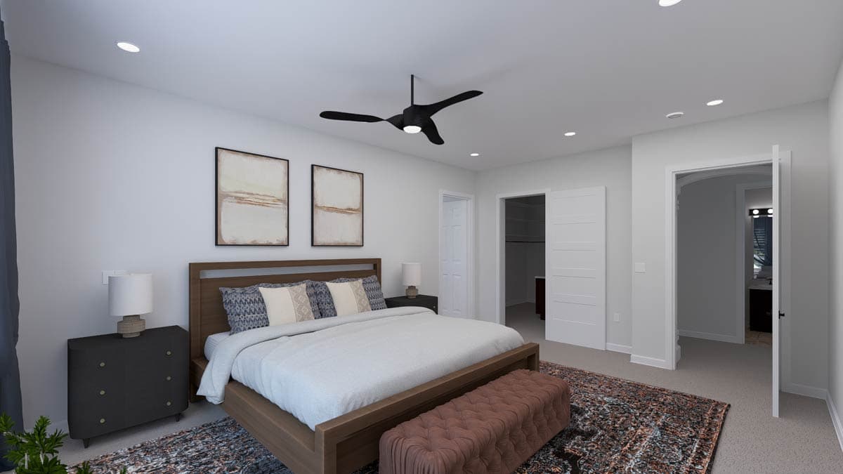 Primary suite with king bed, modern ceiling fan, recessed lighting, and adjoining closet and bathroom.
