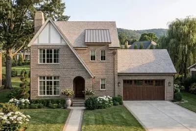 Elegant Tudor House Plan with 3 Bedrooms and Versatile Sunroom