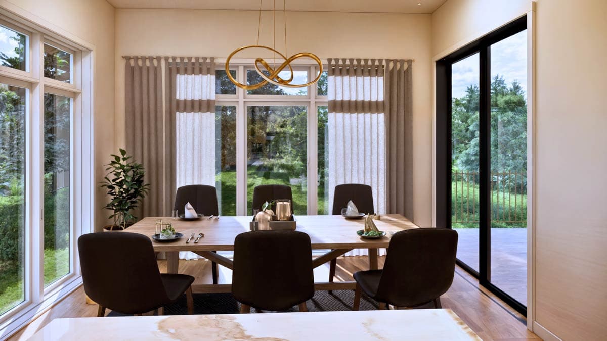 Dining room with large windows, sliding glass door, and a wooden dining table set for six.