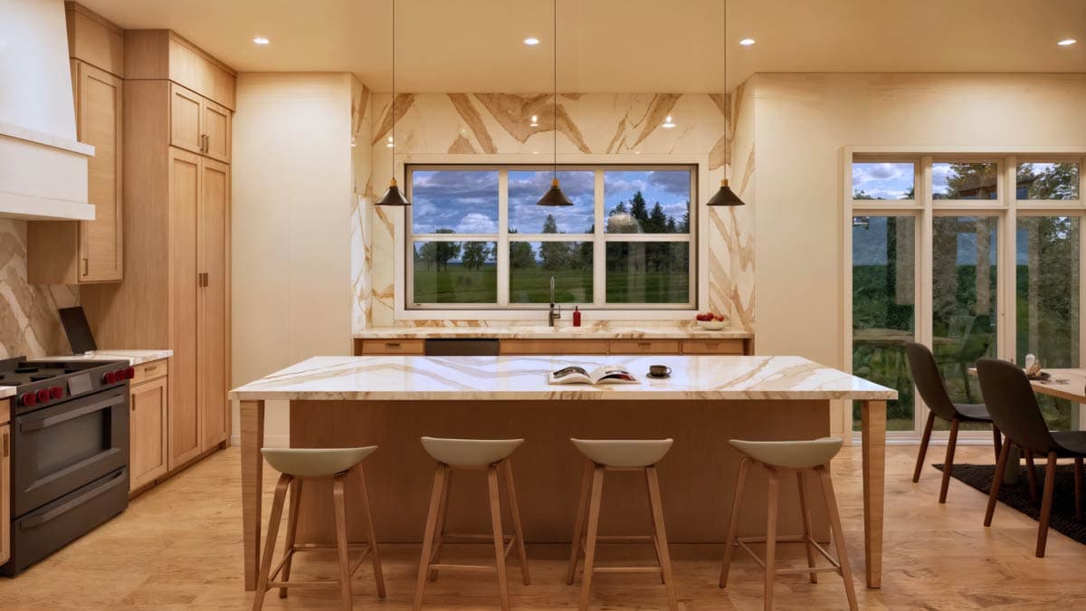Kitchen with large island, wood cabinetry, marble backsplash and countertops, and a large picture window overlooking a landscape.