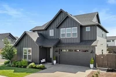 Four-Bedroom Modern Farmhouse House Plan with Den and Workshop