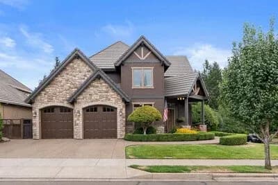 Expansive 4-Bedroom Tudor Craftsman House Plan with Den and Workshop