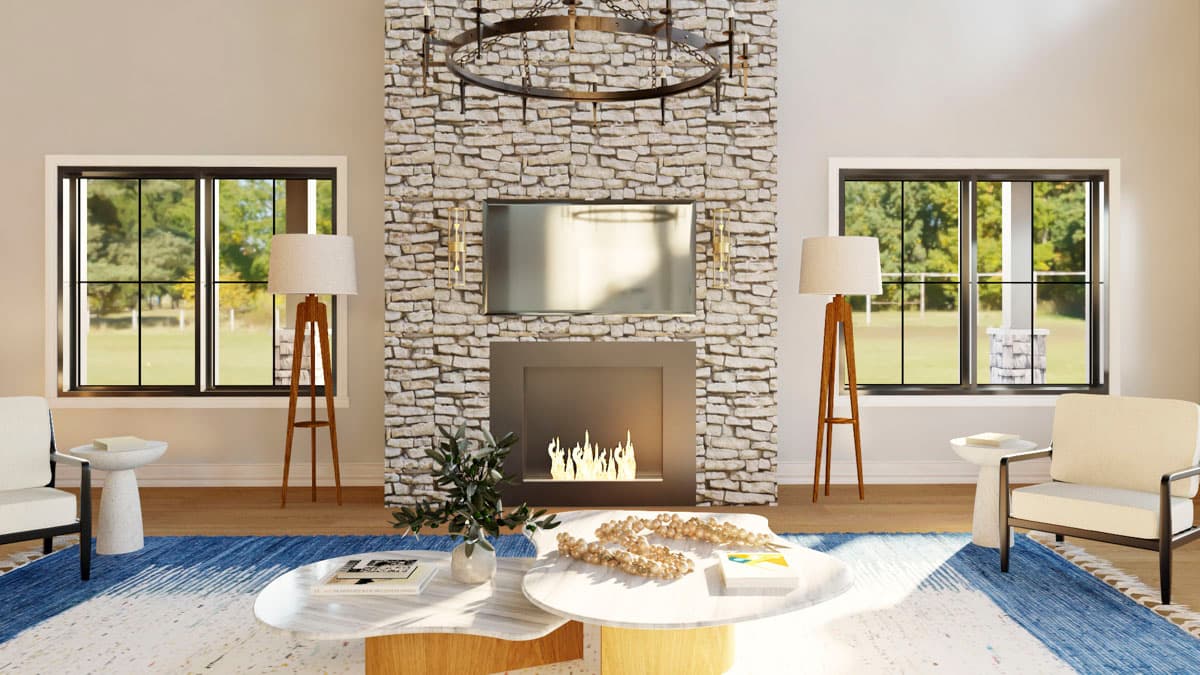 Great room interior with a stone fireplace, large windows, and modern furniture.
