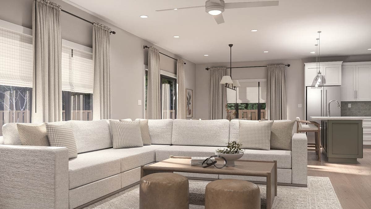 Rendering of an open-concept living room with sectional sofa, coffee table, and adjacent kitchen with island and pendant lights.