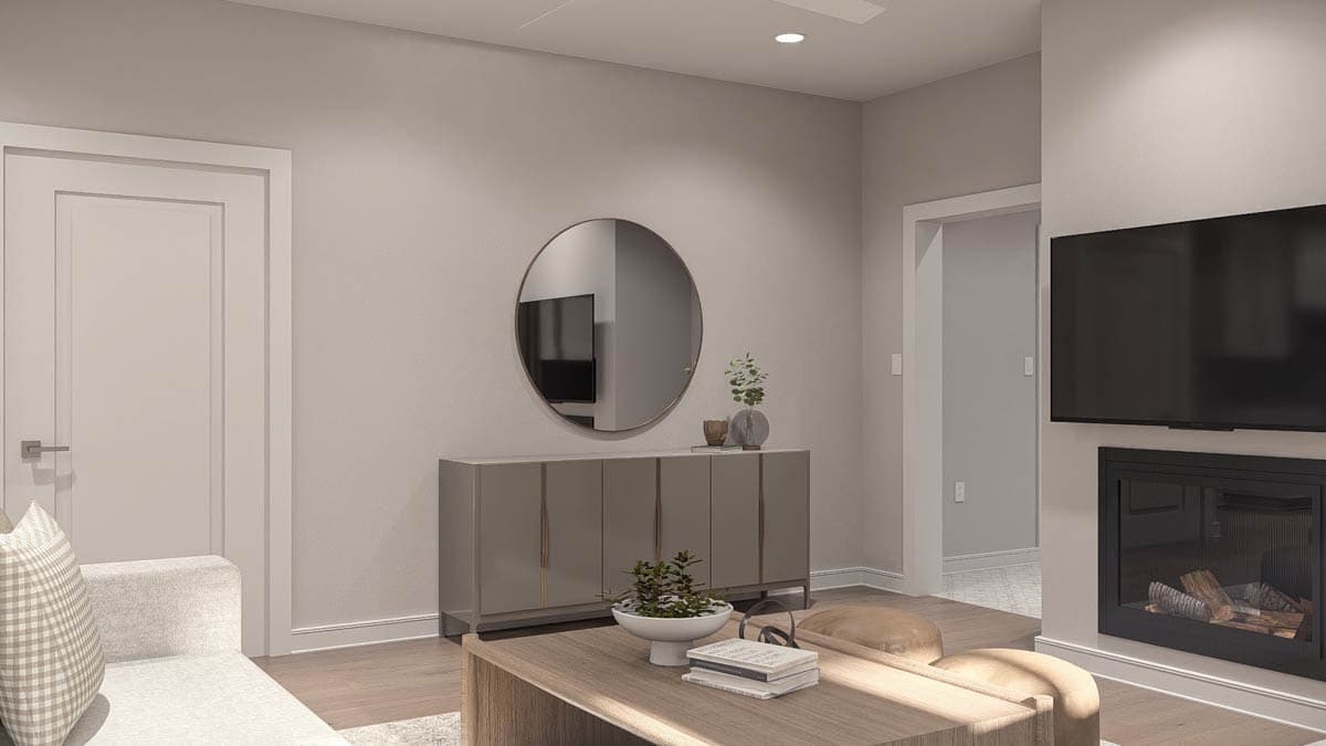 Rendering of a living room with a fireplace, sectional sofa, sideboard, and large round mirror above.