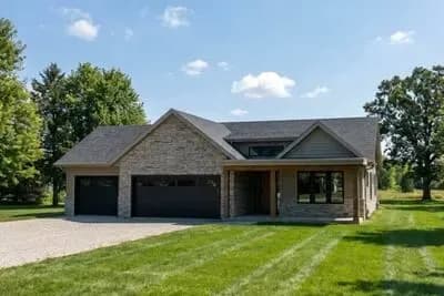 New American Ranch House Plan with Split Bedrooms and 3-Car Garage