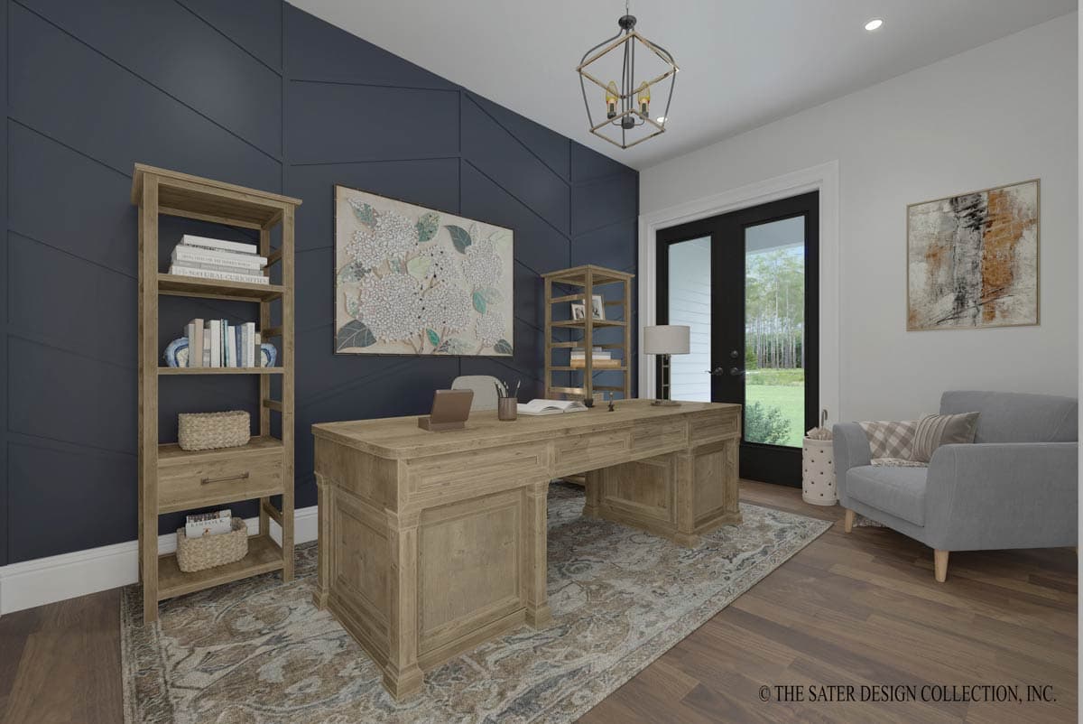 Home office with large wooden desk, bookshelf, patterned wall, double doors, and armchair.