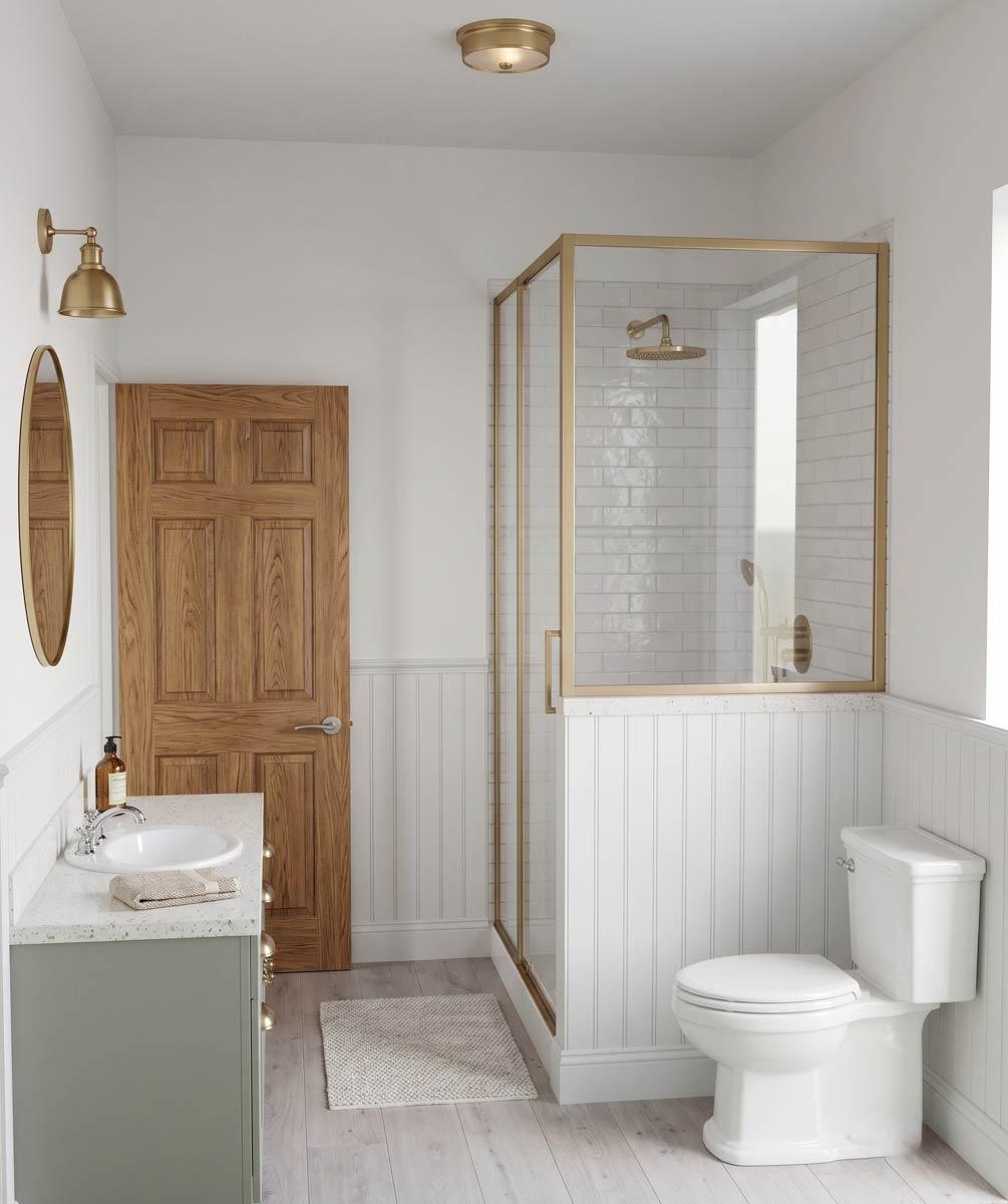 Bathroom with single vanity, pocket door, toilet, and glass-enclosed shower with white subway tile.