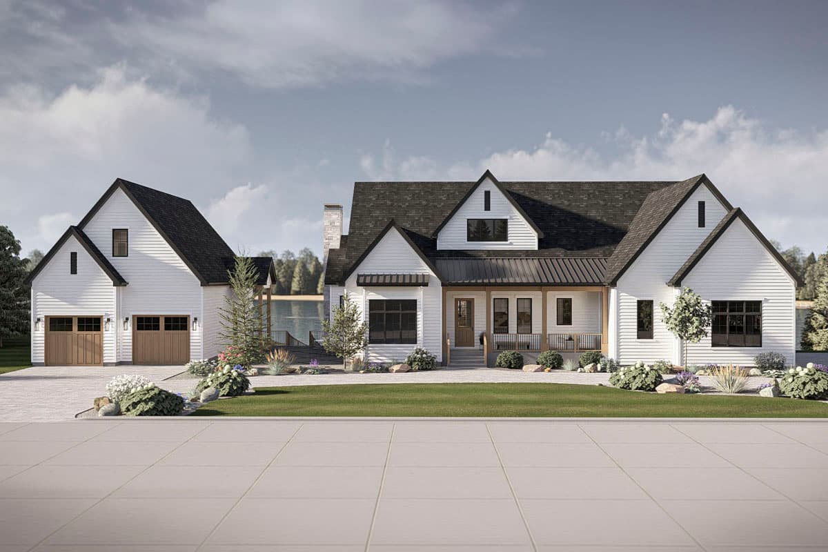 Modern Farmhouse house plan exterior with gabled dormers, a covered front porch, and a detached two-car garage.