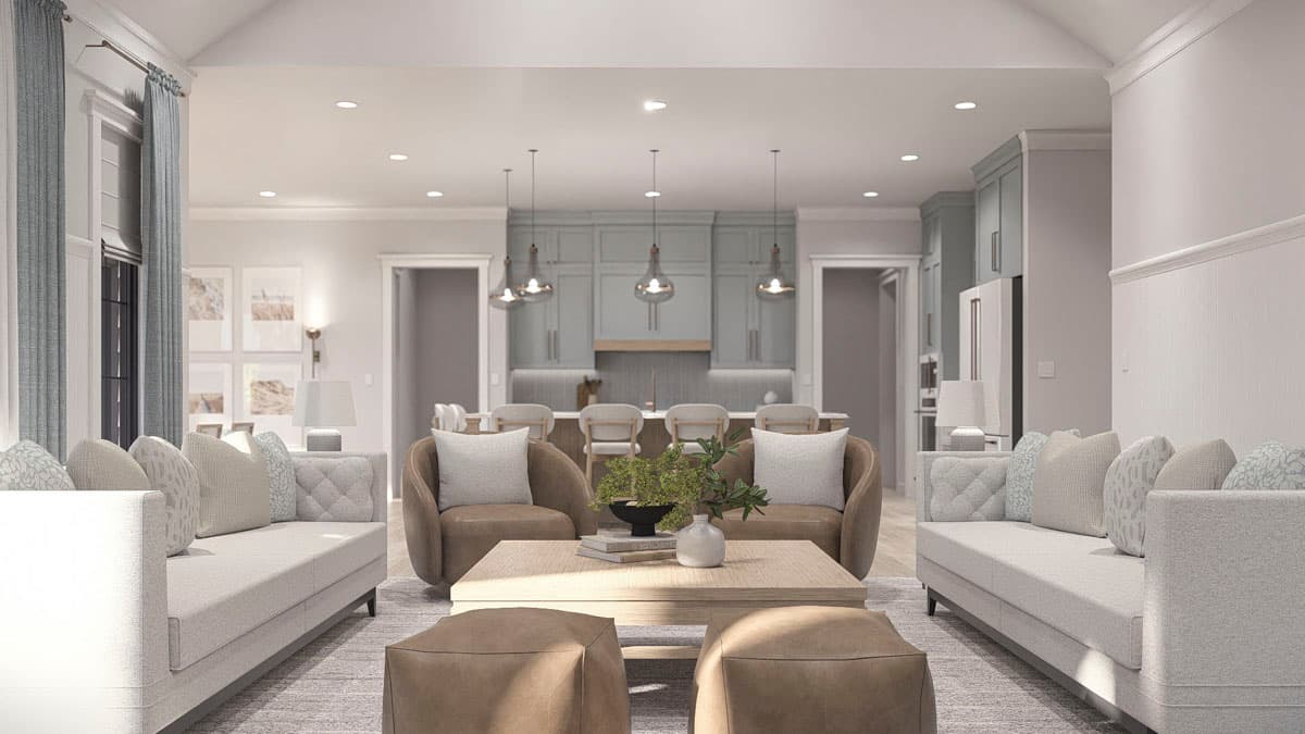 Great room with vaulted ceiling and open view to kitchen with island and pendant lighting.