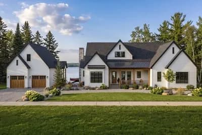 Sprawling Four-Bedroom Farmhouse House Plan with Four-Car Garage and Wraparound Porch