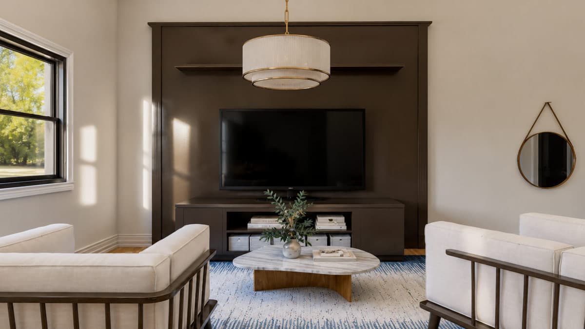 Living room with built-in entertainment center, sectional sofa, marble coffee table, and modern chandelier.
