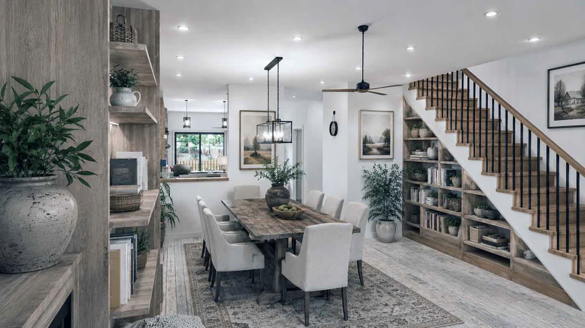 Interior view of dining area with staircase, built-in bookshelves, and natural wood table.