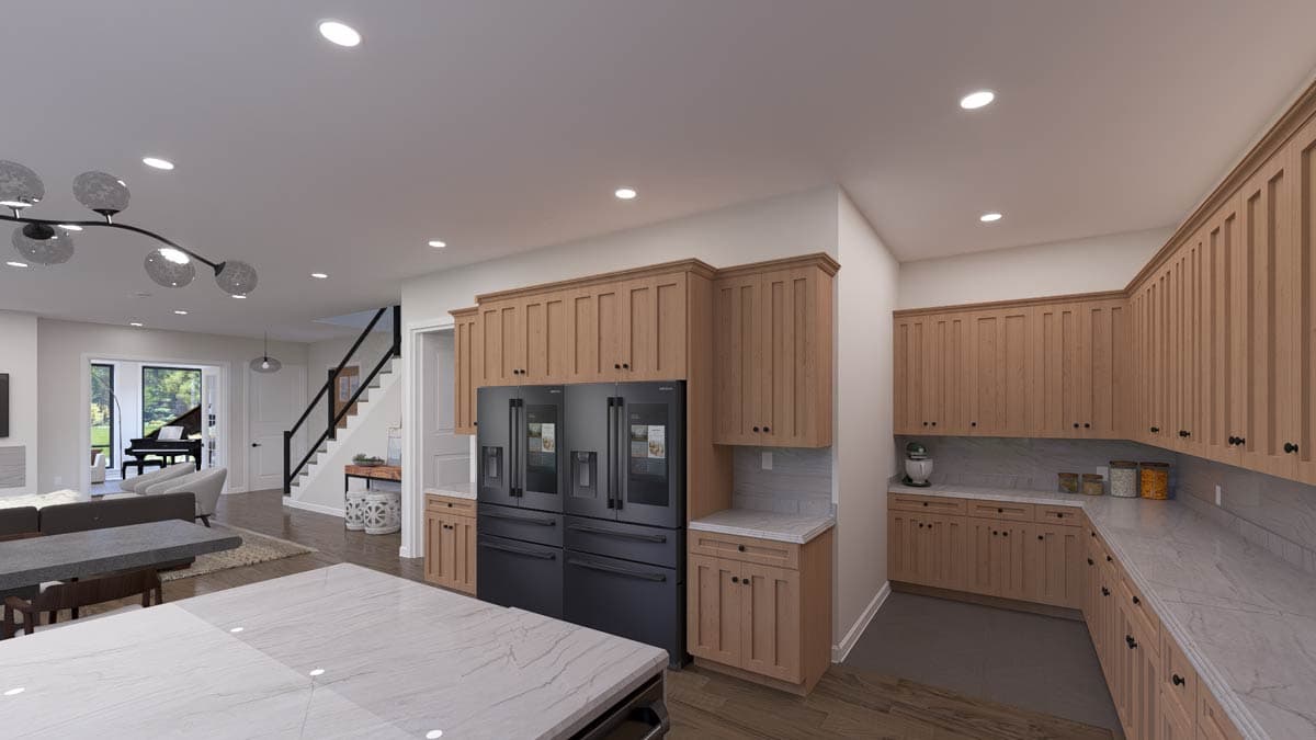 Kitchen with light wood cabinetry, dual refrigerators, and marble countertops, opening to a living area with a grand piano.