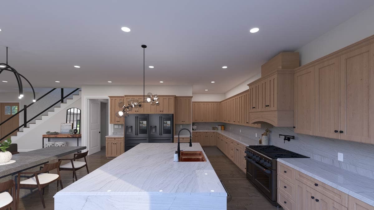 Open-concept kitchen with large island, light wood cabinetry, and stainless steel appliances.