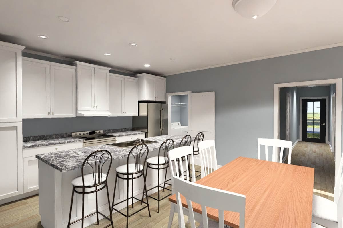 Kitchen and dining area with island, white cabinets, granite countertops, dining table, and view to hallway with exterior door.