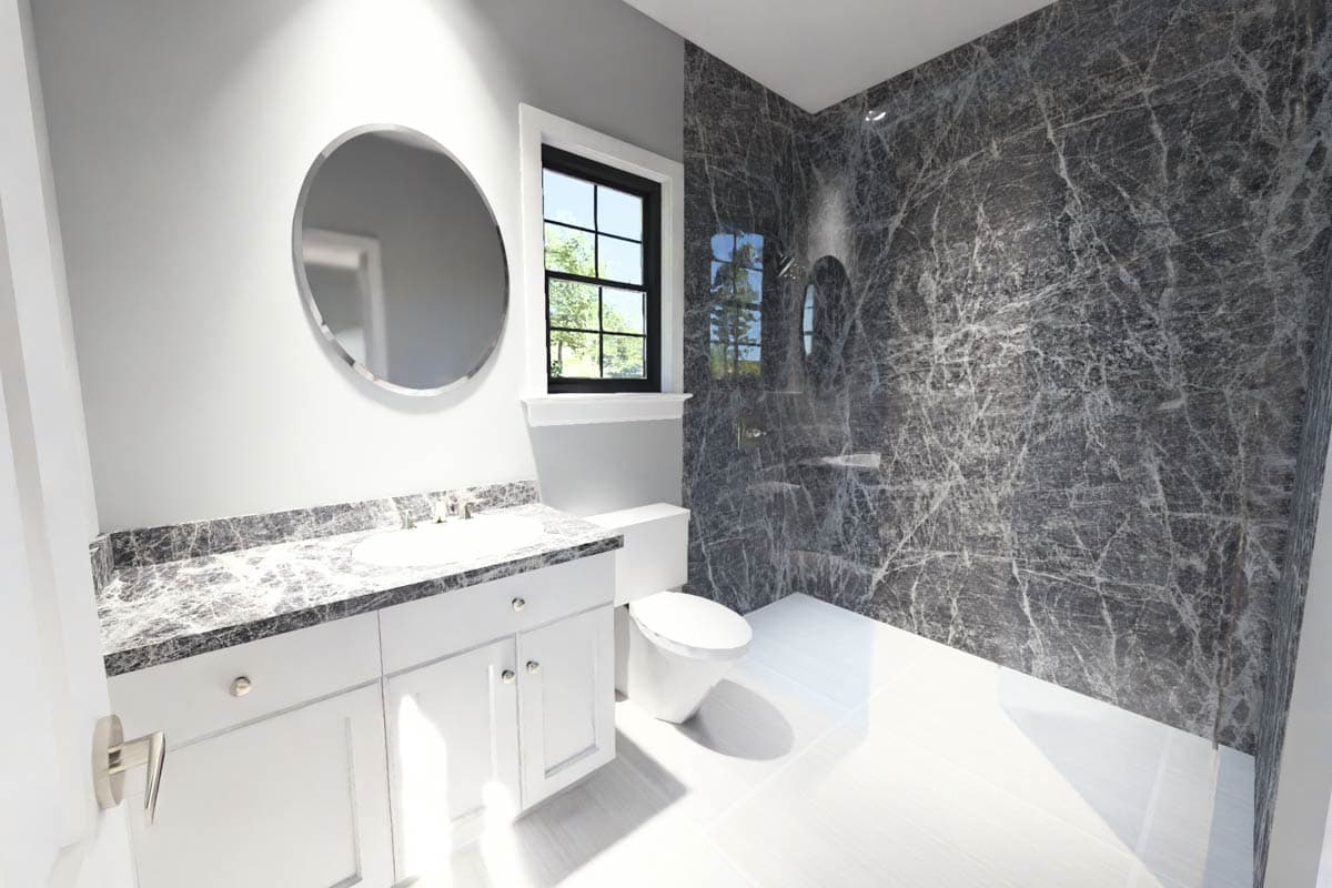 Bathroom with white vanity, marble countertop, round mirror, and a walk-in shower with dark marble tile.