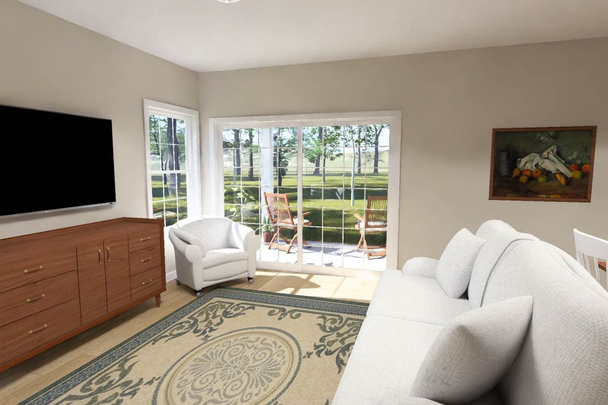 Living room interior with sofa, armchair, media console, large sliding glass doors, and two windows.