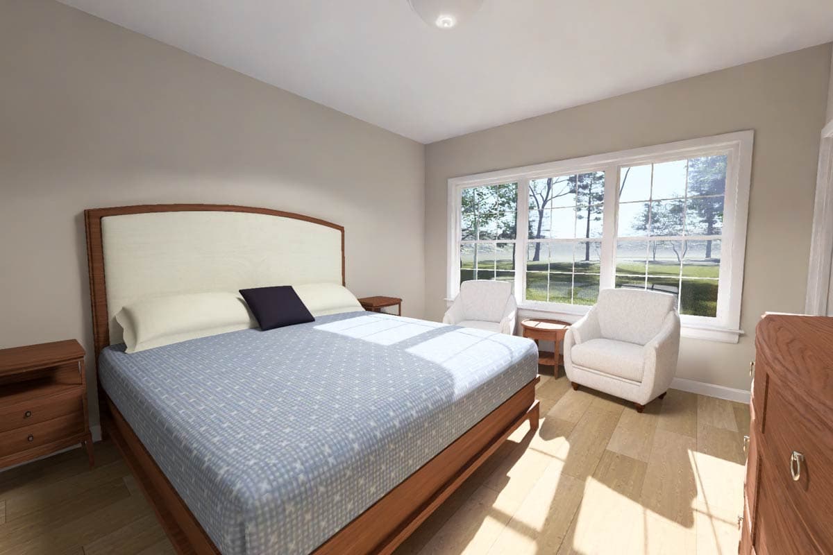 Primary bedroom with wood-frame bed, large windows, and two accent chairs.