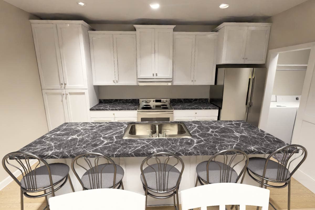 Kitchen interior with white cabinetry, granite countertops, stainless steel appliances, and a large island with seating.