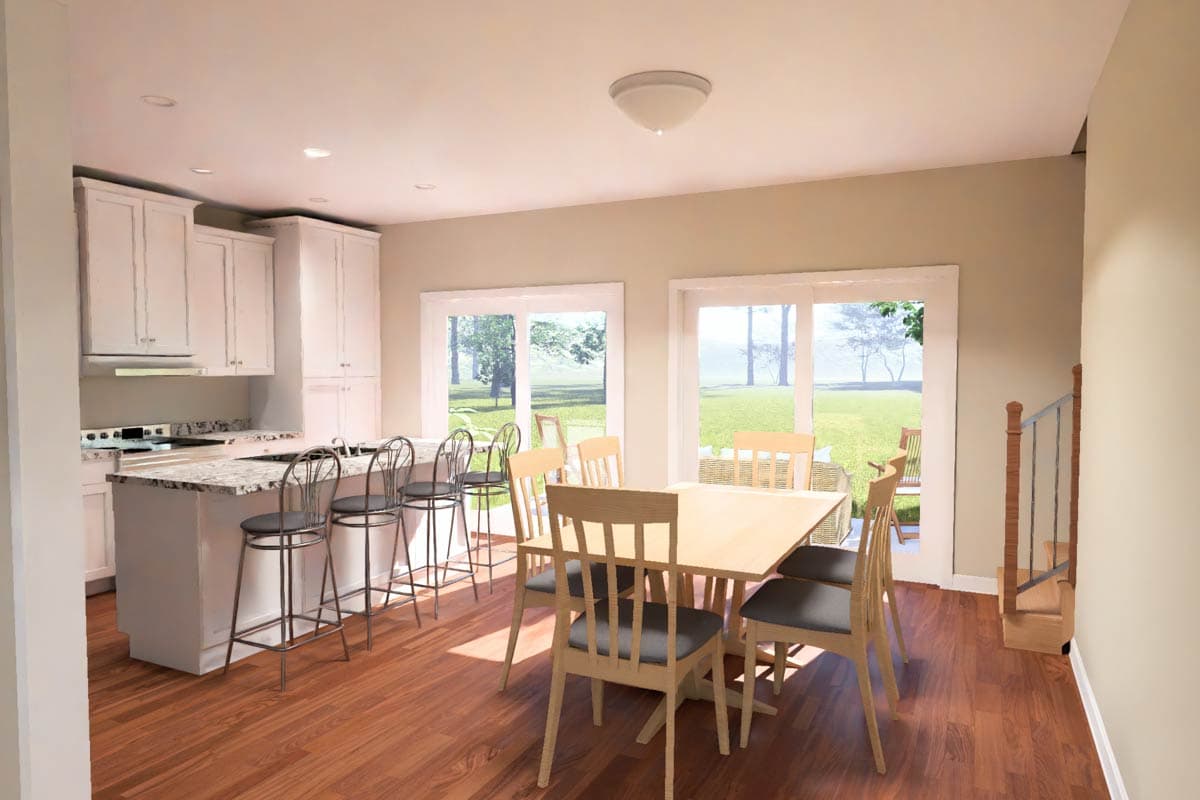 Kitchen and dining area with island, bar stools, and dining table. Sliding doors open to outdoor patio. Stairs visible.