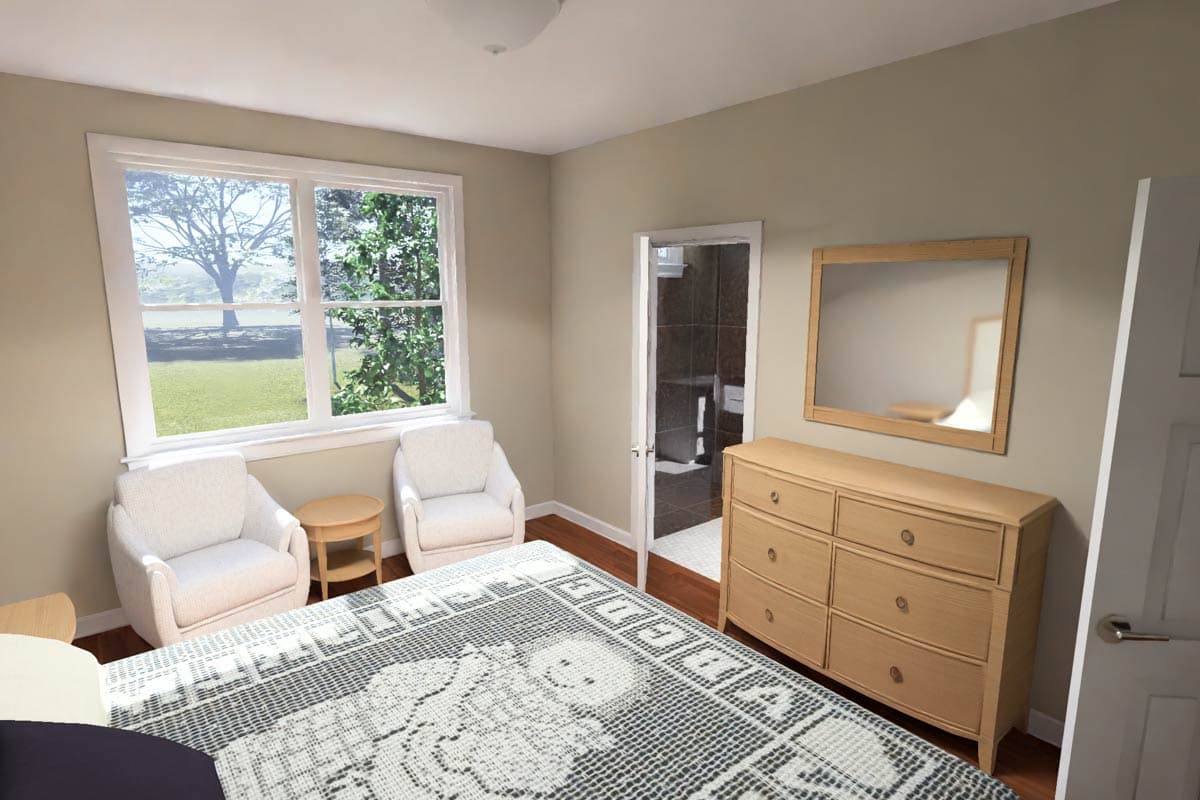 Bedroom with large window, two chairs, dresser, and doorway to bathroom.
