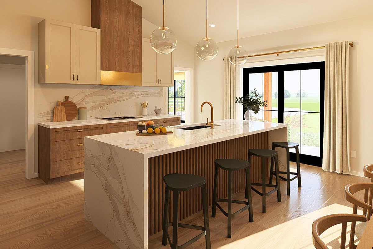Contemporary kitchen with marble island, wood cabinetry, and a large window. Vaulted ceiling with pendant lights.